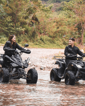 A photo of a couple enjoying an ATV ride along Chocolate Hills