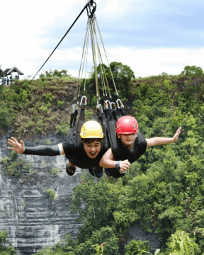 A photo of two tourists enjoying a zipline in Danao Adventure Park