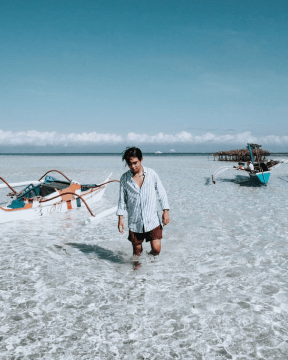 A photo of a tourist, off the boat, enjoying the islands of Balicasag